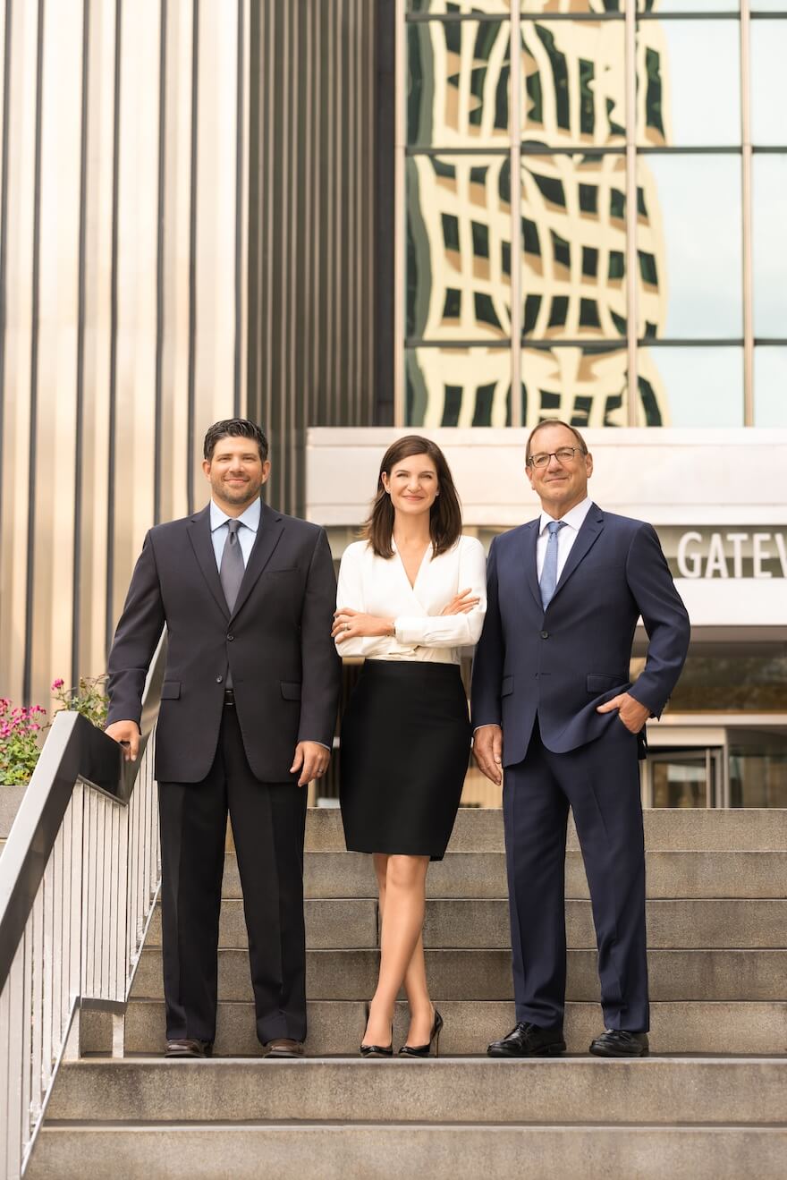 Team in front of building
